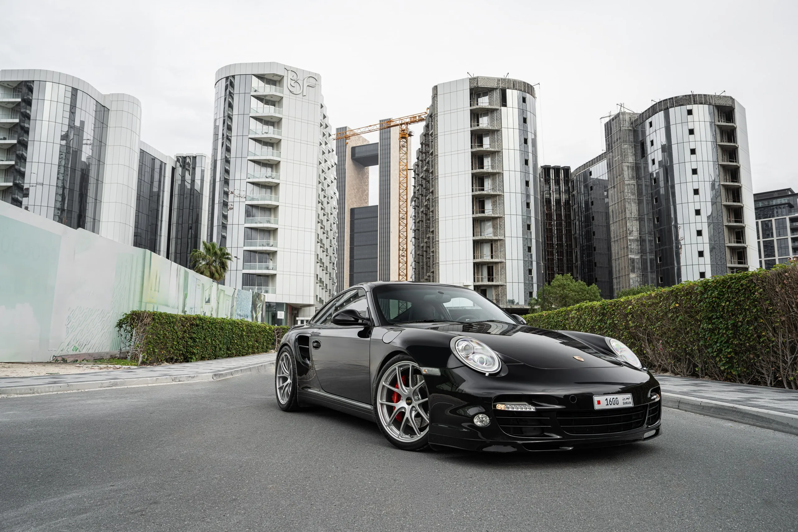 Black Porsche 911 on a city street