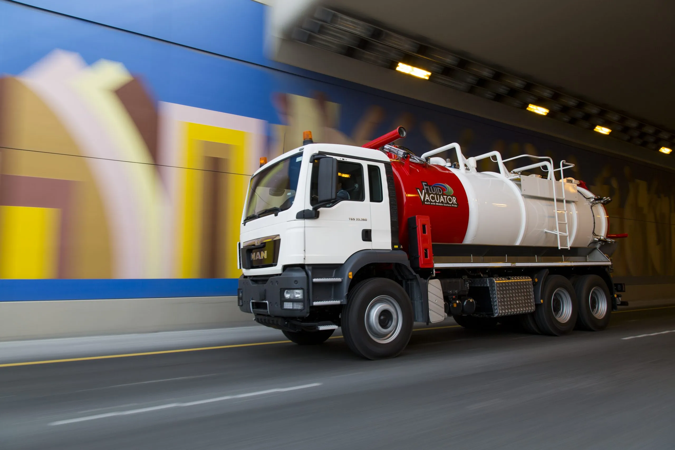 Tanker truck speeding through a tunnel