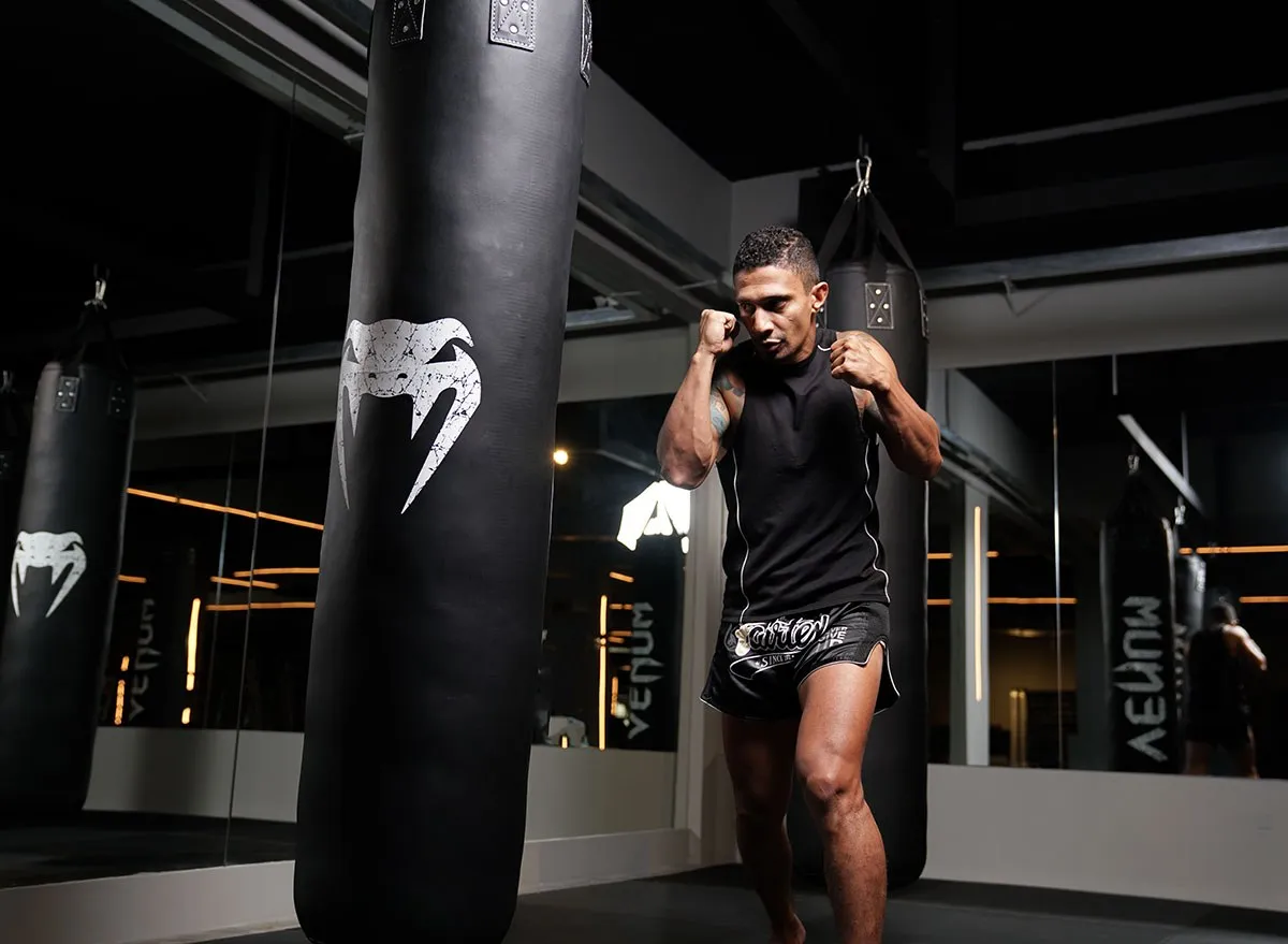 Boxer training on a heavy bag