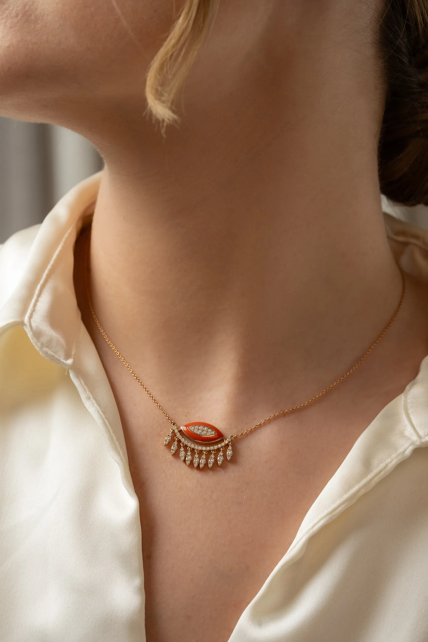 Delicate gold chain on bare skin