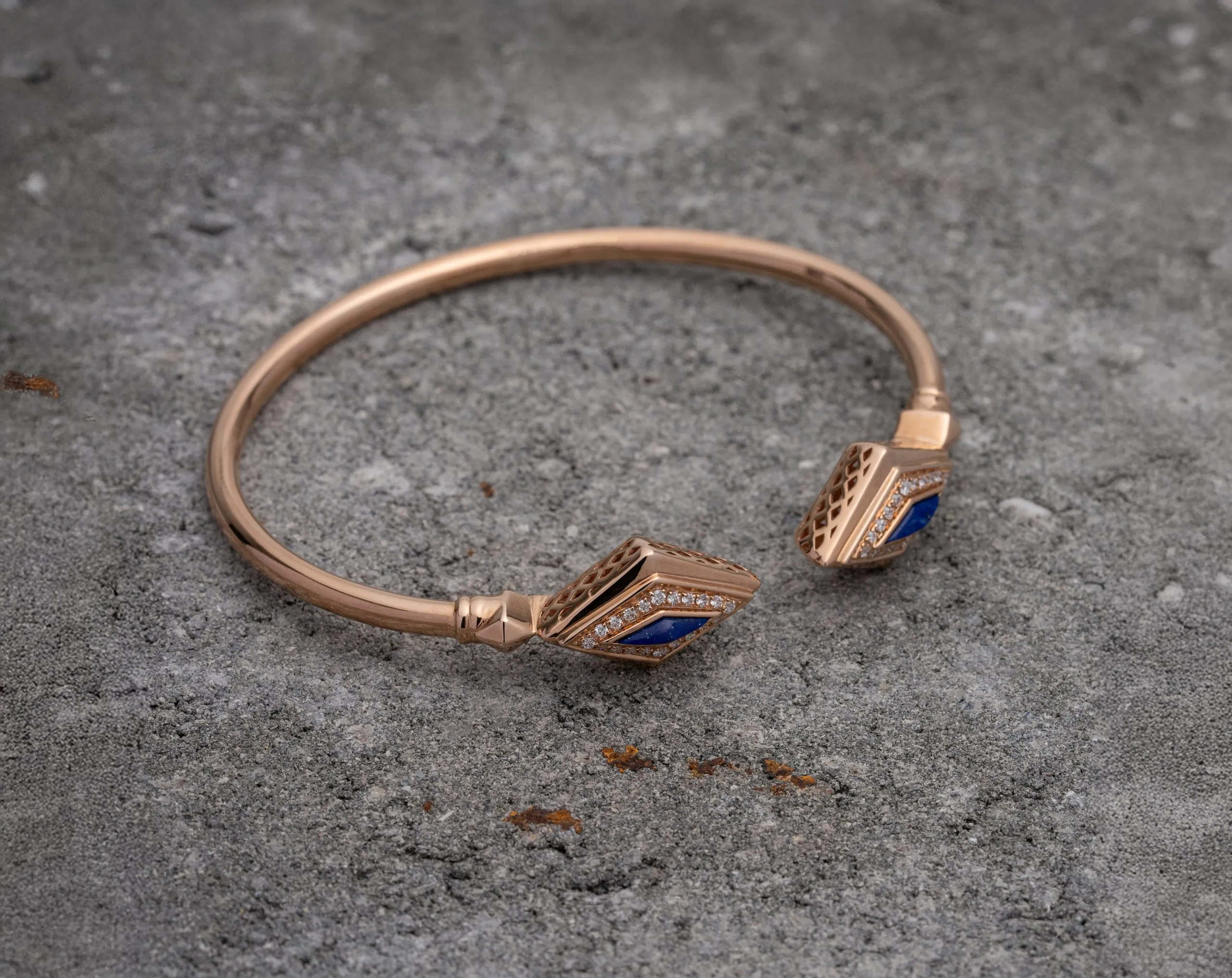 Rose gold bangle on grey stone