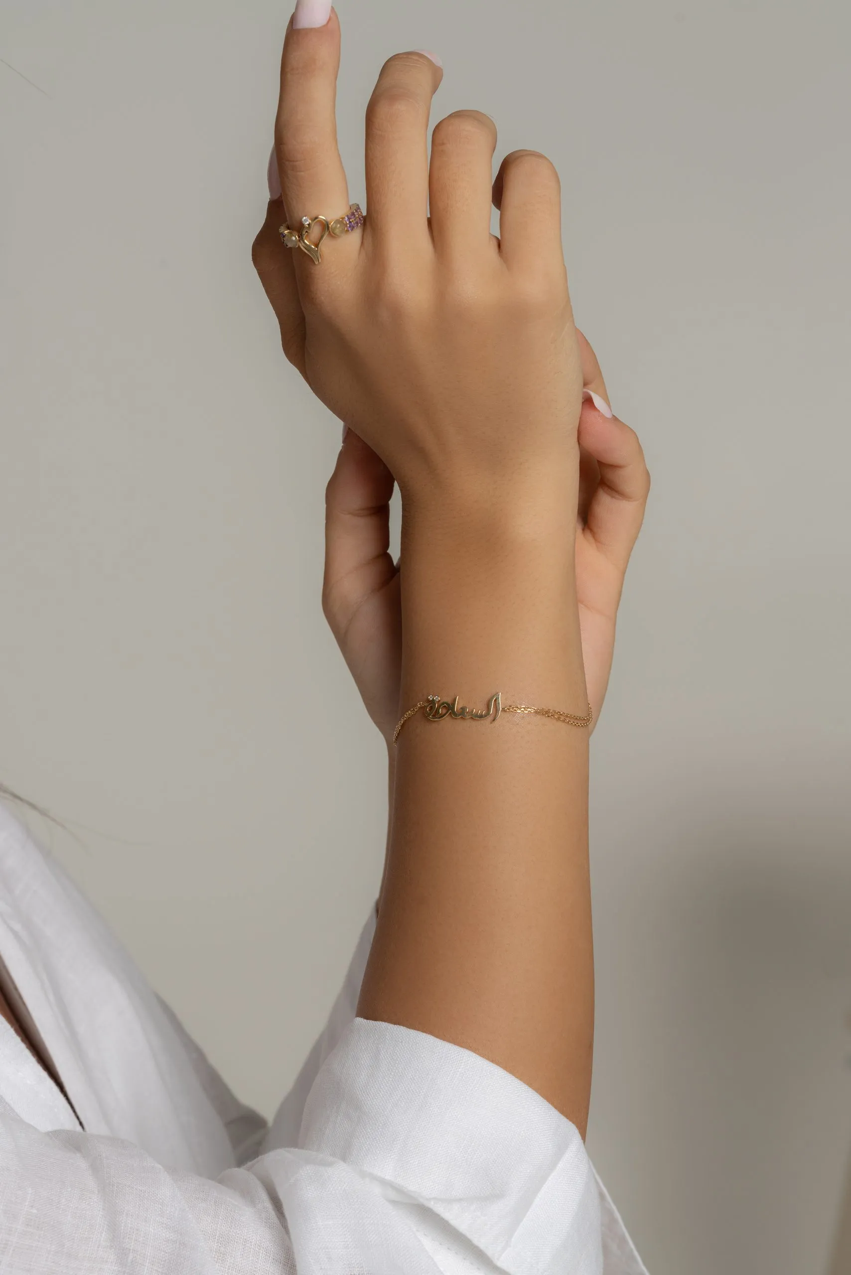 Gold bracelet on a woman's wrist