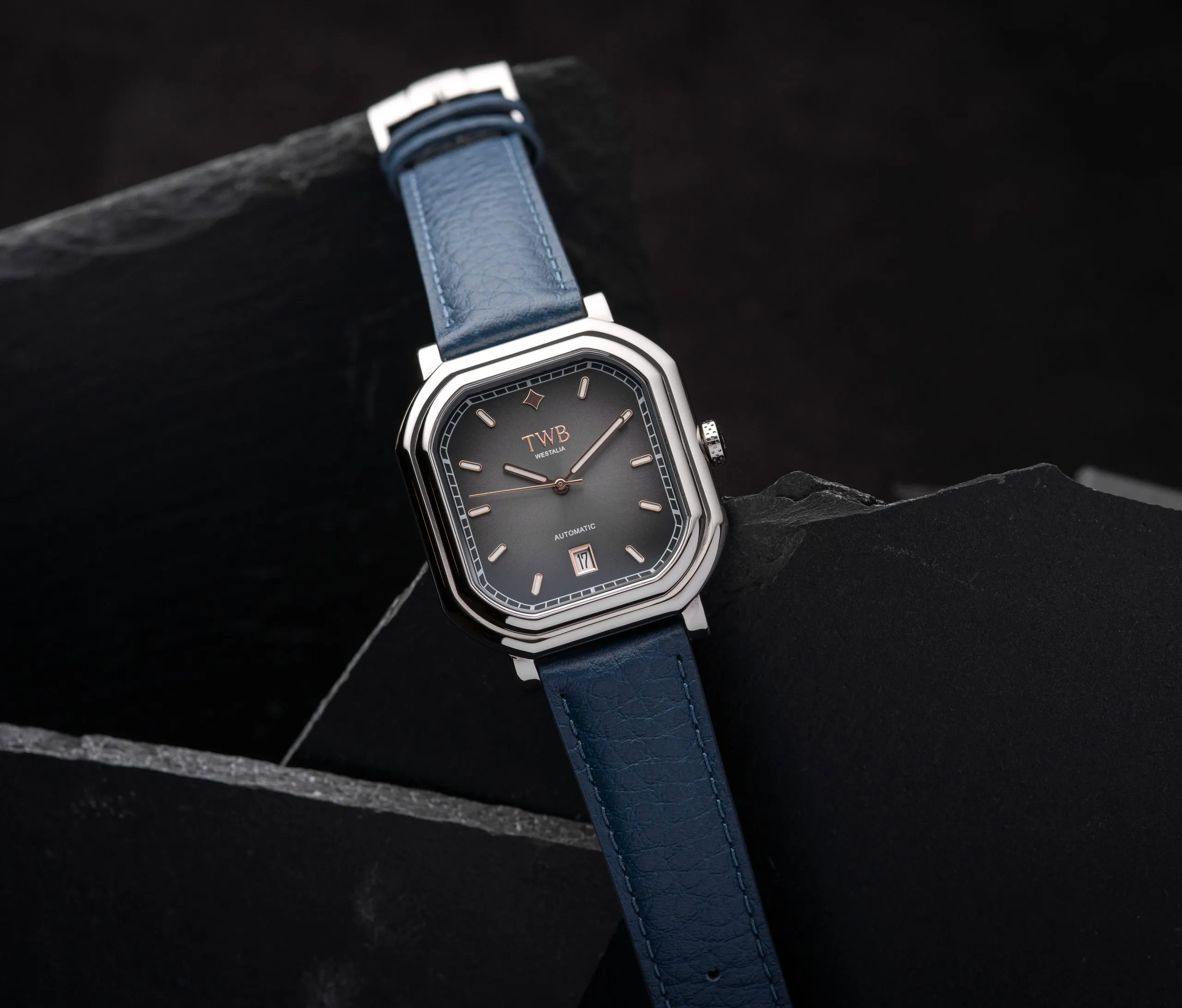 Steel watch on a blue strap, close up