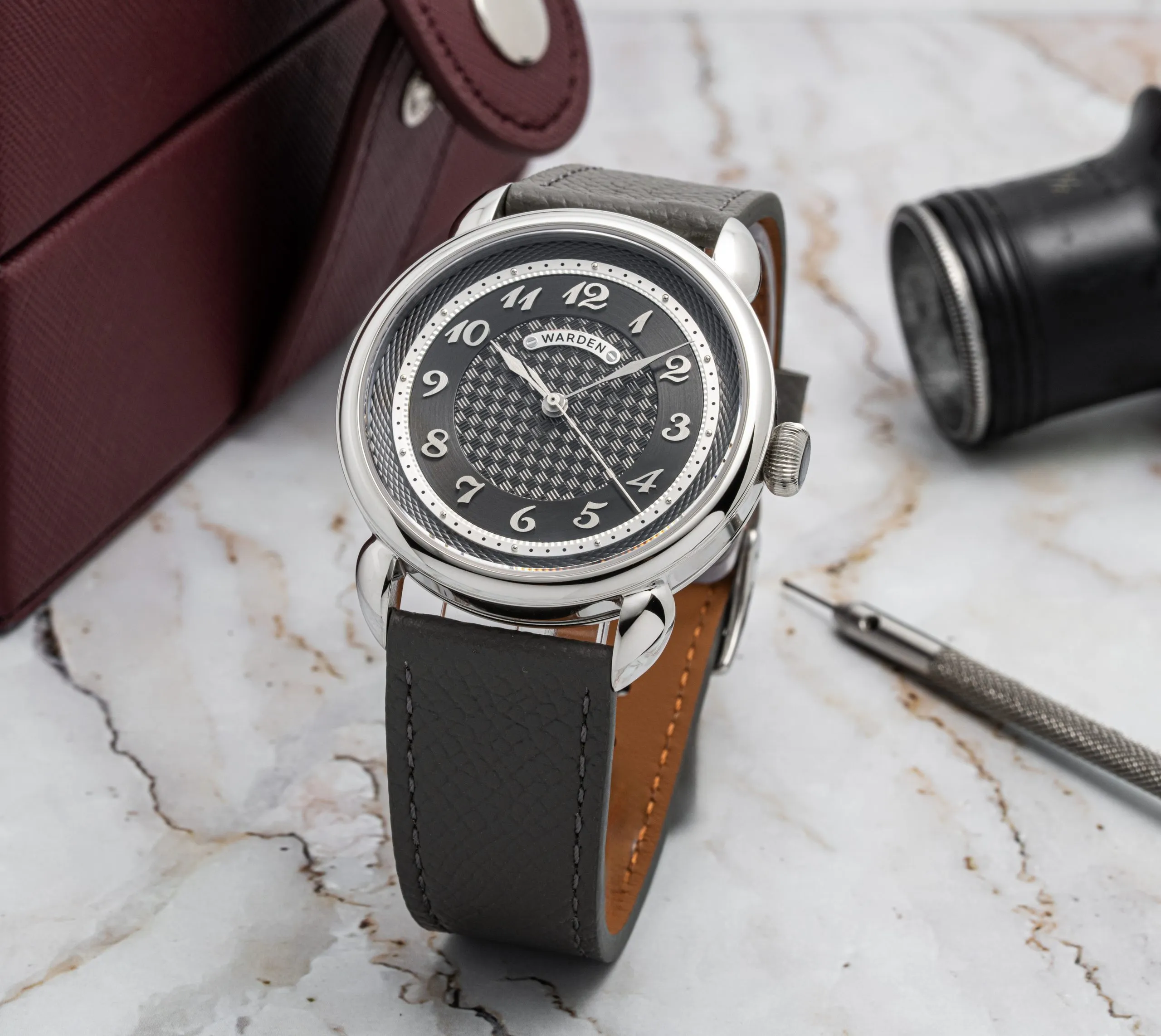 Watch resting on dark leather