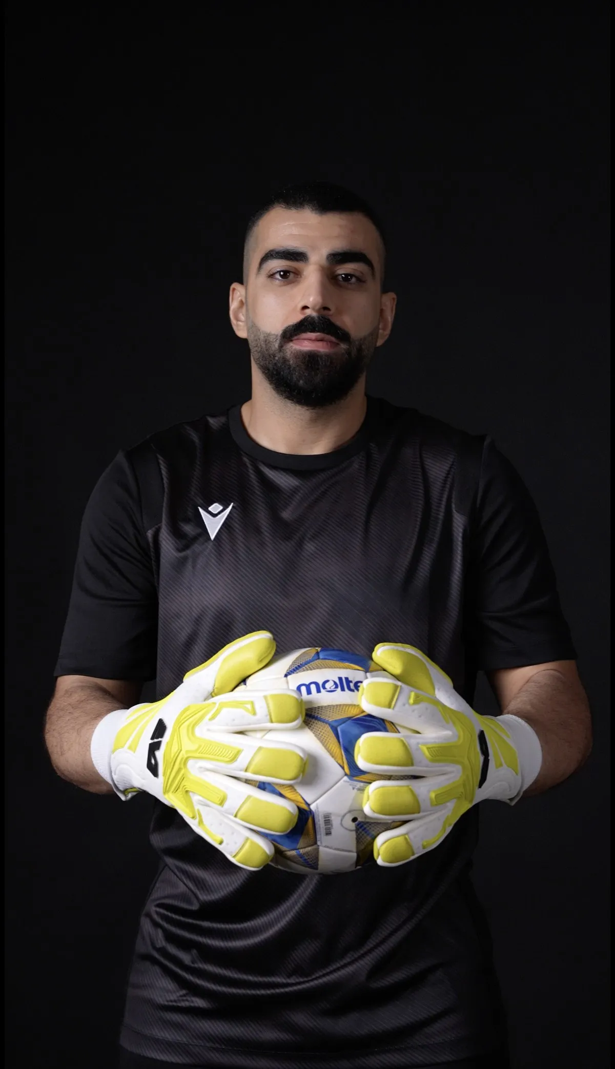 Athlete holding goalkeeper gloves