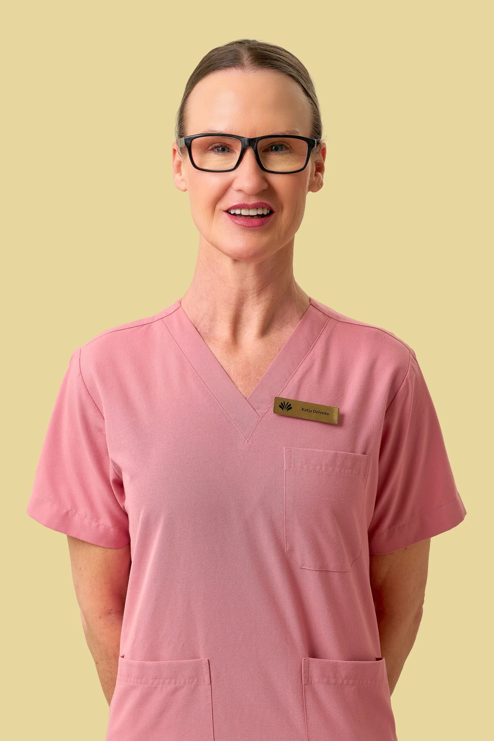 Nurse in pink scrubs