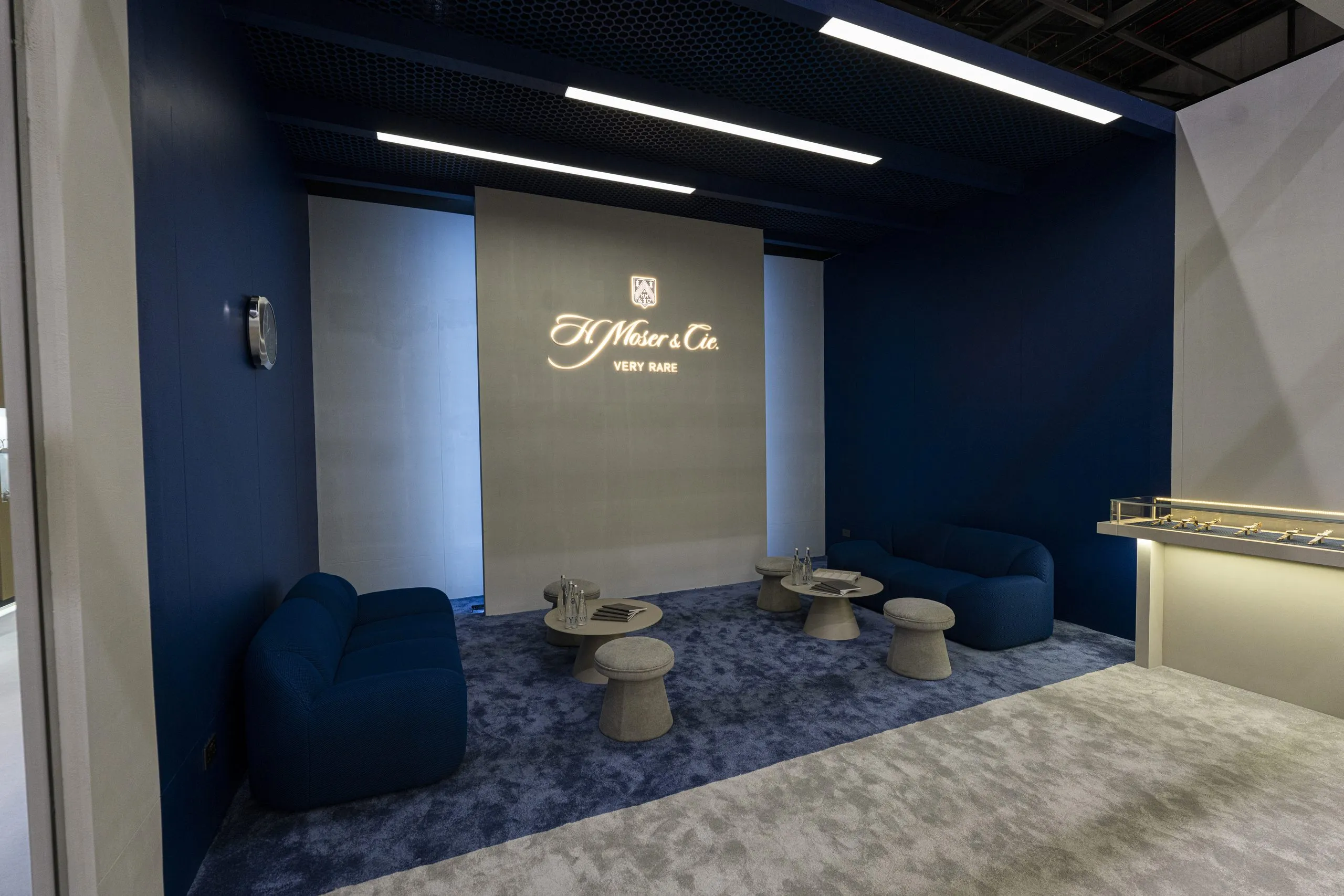Navy lounge seating in a marble showroom