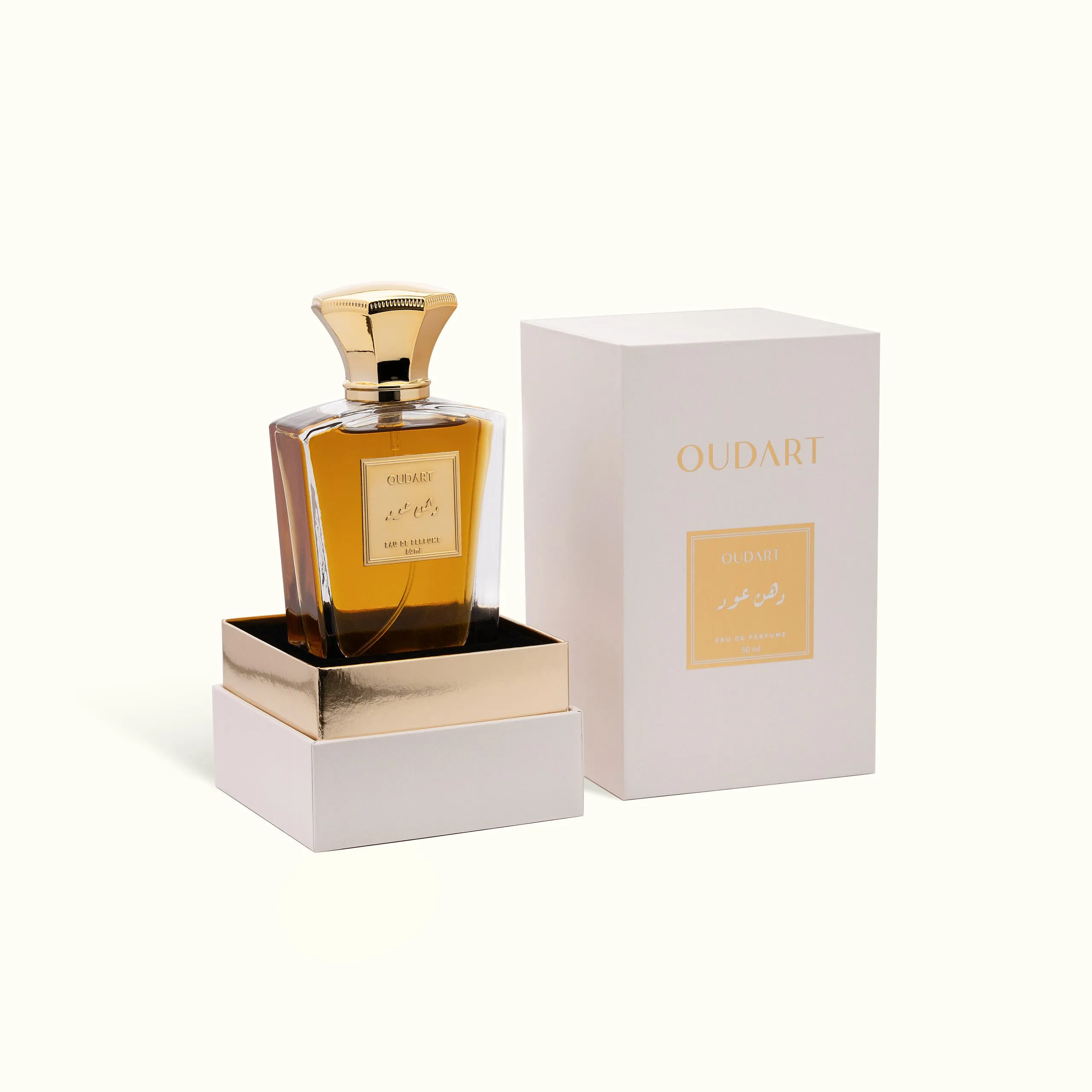 Perfume bottle beside its gold box