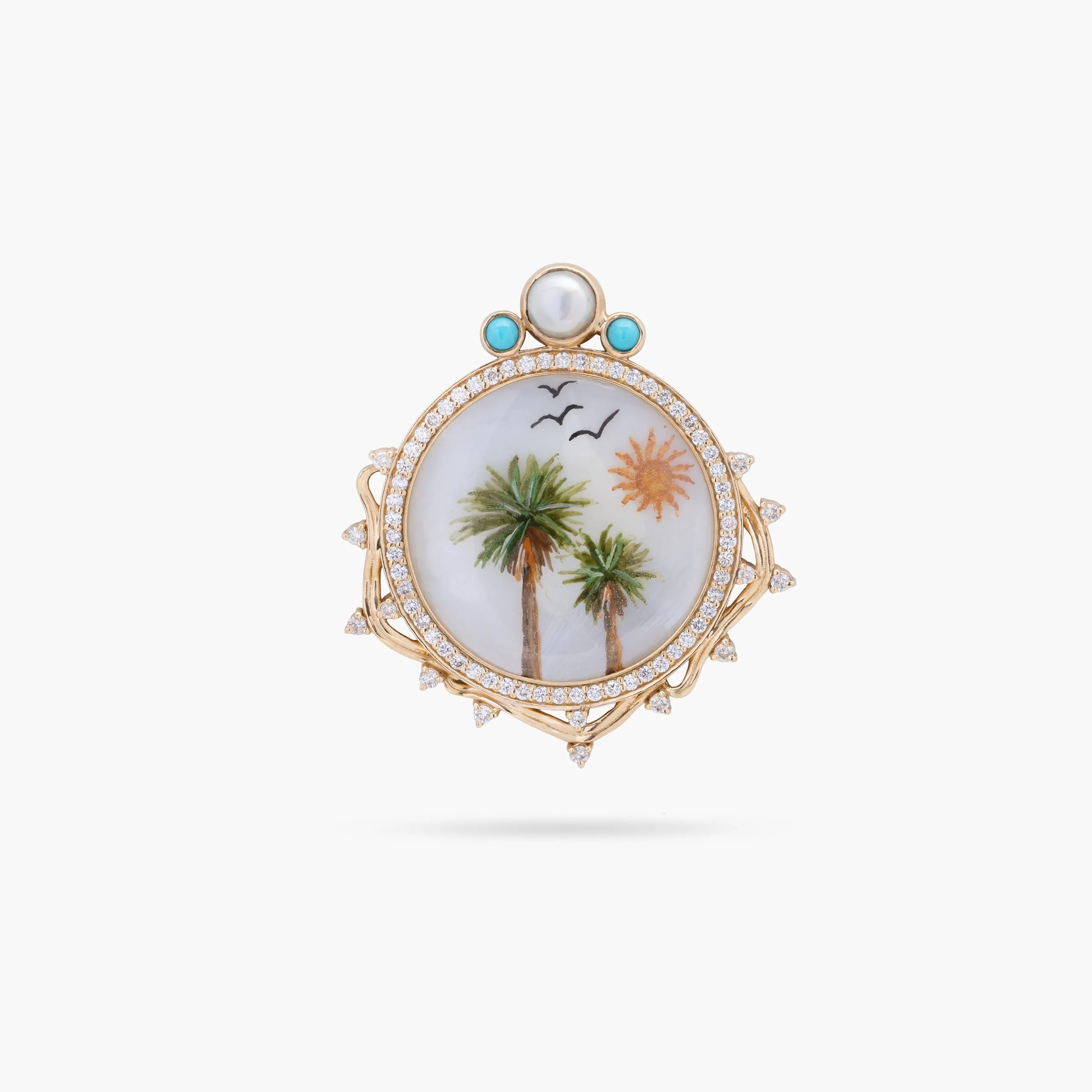 Ornate gold pendant with palm motif